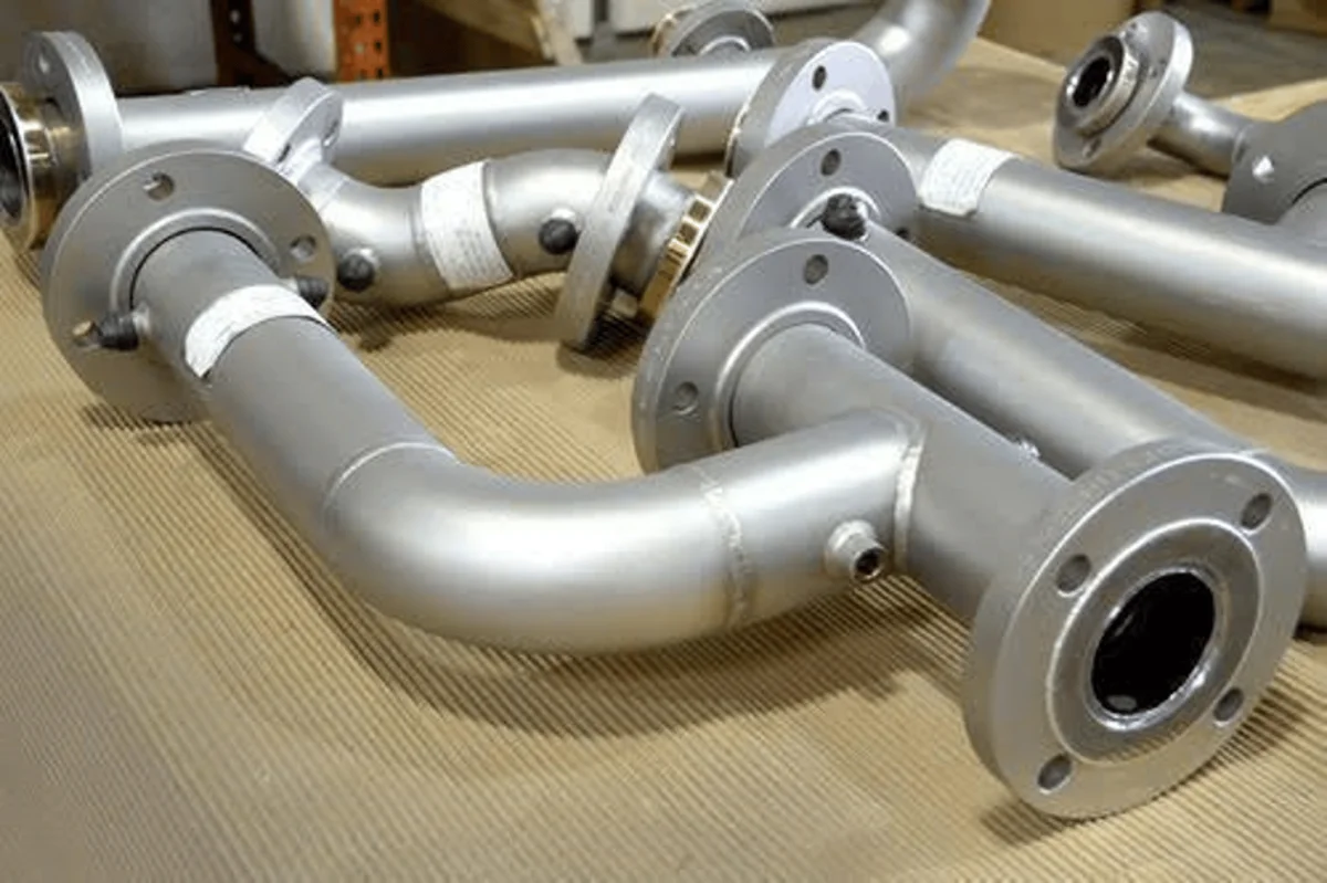 Fabricated pipe spools arranged in a workshop